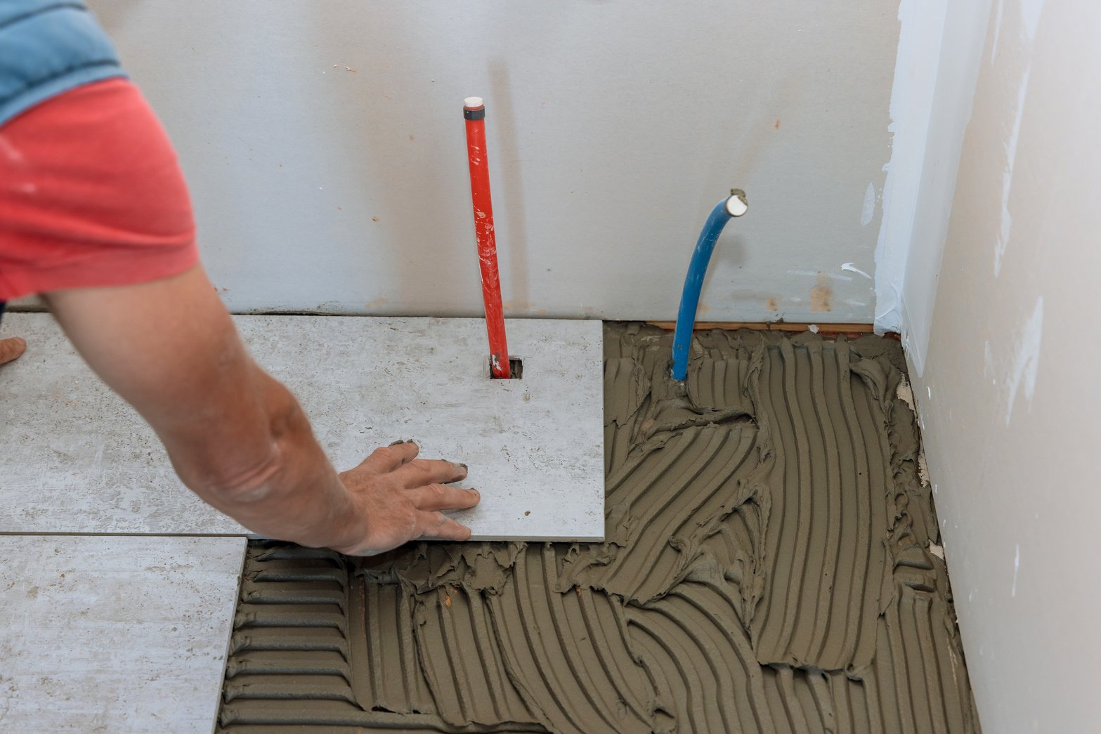 Floor Tile Installation Witht Tiler Placing Porcelain Tile